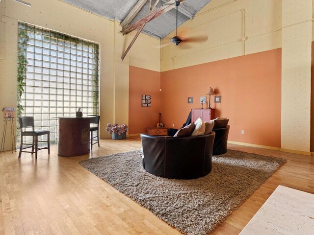 834 N Water St, Sheboygan, WI 53081 - living room featuring hardwood / wood-style floors, ceiling fan, and a high ceiling