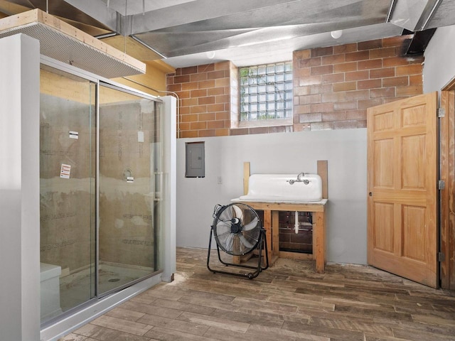 834 N Water St, Sheboygan, WI 53081 - bathroom with electric panel and hardwood / wood-style floors