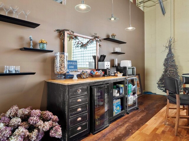 834 N Water St, Sheboygan, WI 53081 - bar with wooden counters, dark hardwood / wood-style floors, pendant lighting, and wine cooler
