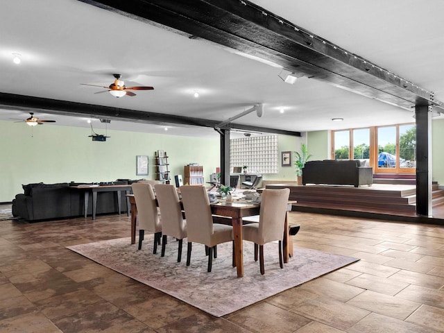 834 N Water St, Sheboygan, WI 53081 - dining space featuring beam ceiling and a wood stove