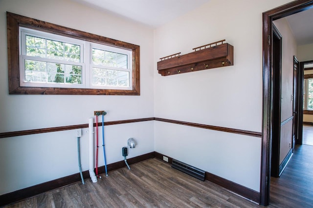 laundry room with dark wood-type flooring