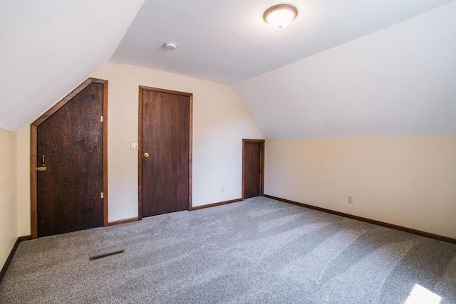 additional living space with lofted ceiling and carpet floors