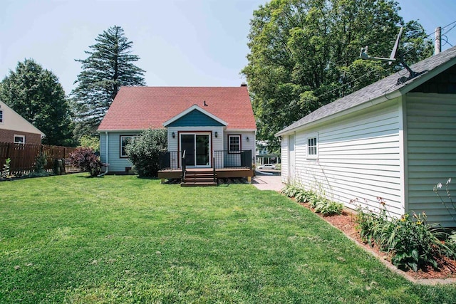 back of house featuring a lawn