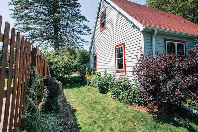 view of home's exterior featuring a yard