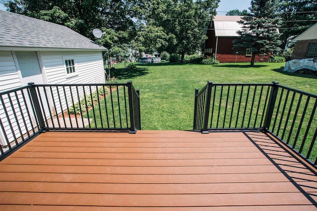 wooden deck with a lawn