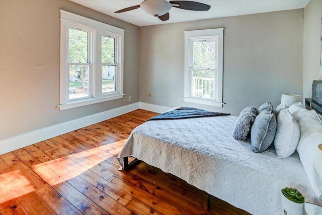 bedroom featuring wood-type flooring and ceiling fan