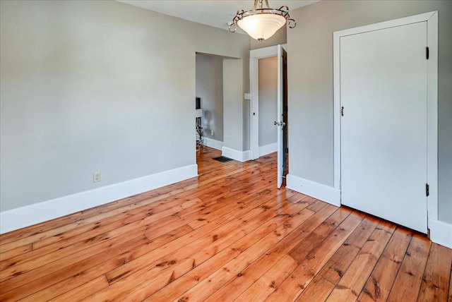 spare room with light hardwood / wood-style flooring