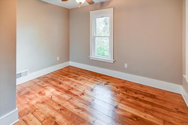 empty room featuring light wood-type flooring and ceiling fan