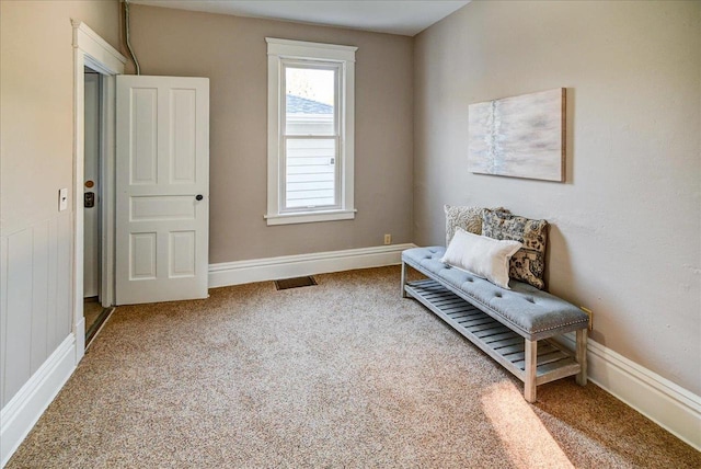 sitting room featuring carpet floors