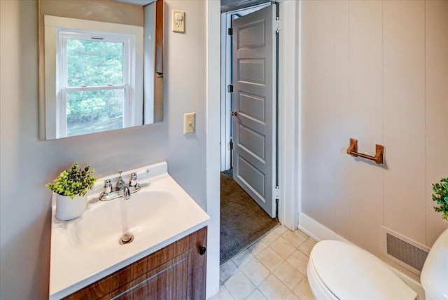 bathroom with vanity and toilet