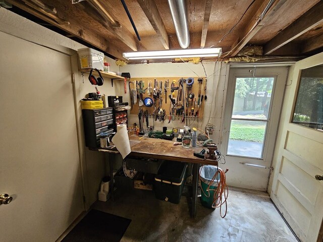 interior space featuring concrete floors and a workshop area