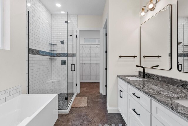 bathroom featuring vanity and shower with separate bathtub