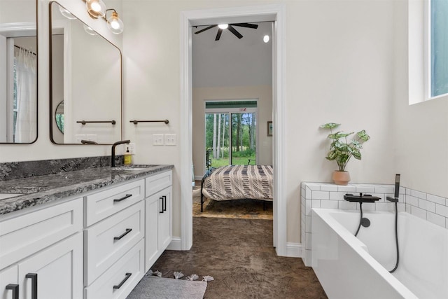 bathroom featuring a bathing tub, vanity, and ceiling fan