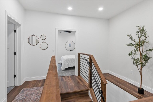 hallway with dark wood-type flooring