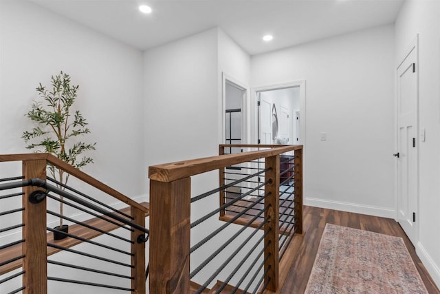 corridor featuring dark wood-type flooring