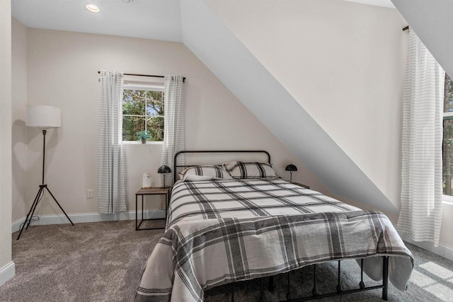 carpeted bedroom with vaulted ceiling