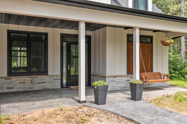 doorway to property featuring a porch