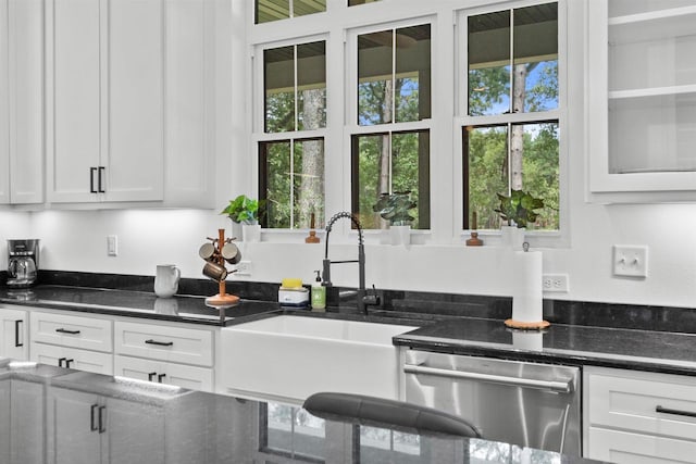 kitchen featuring white cabinets, plenty of natural light, sink, and dishwasher