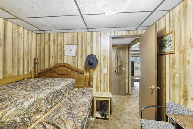 bedroom featuring wood walls