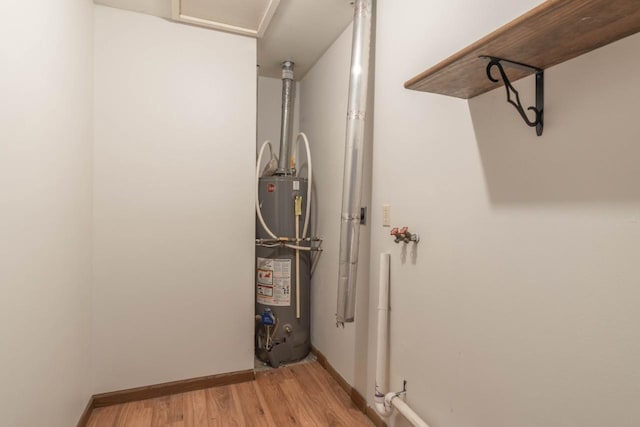 utility room with water heater