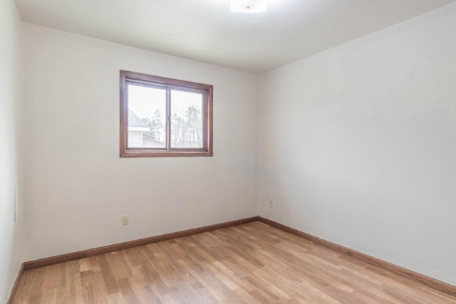 spare room with light hardwood / wood-style floors