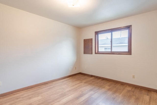 unfurnished room featuring light hardwood / wood-style flooring