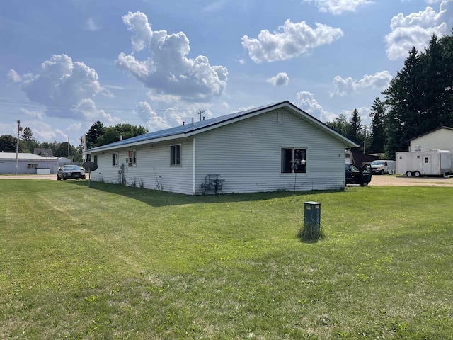 view of property exterior with a yard