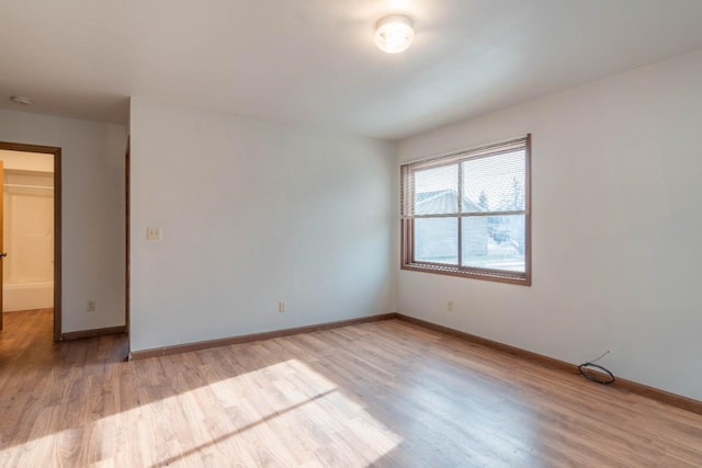 unfurnished room featuring light hardwood / wood-style floors