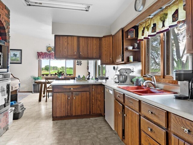 W7031 Hickory Ln, Elkhart Lake, WI 53020 - kitchen with open shelves, light countertops, stainless steel oven, a sink, and dishwasher