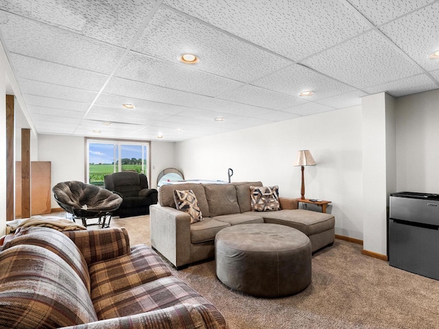 W7031 Hickory Ln, Elkhart Lake, WI 53020 - carpeted living area featuring a paneled ceiling and baseboards