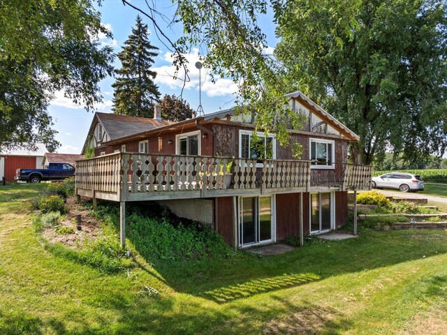 W7031 Hickory Ln, Elkhart Lake, WI 53020 - back of property with a deck, a yard, and a chimney