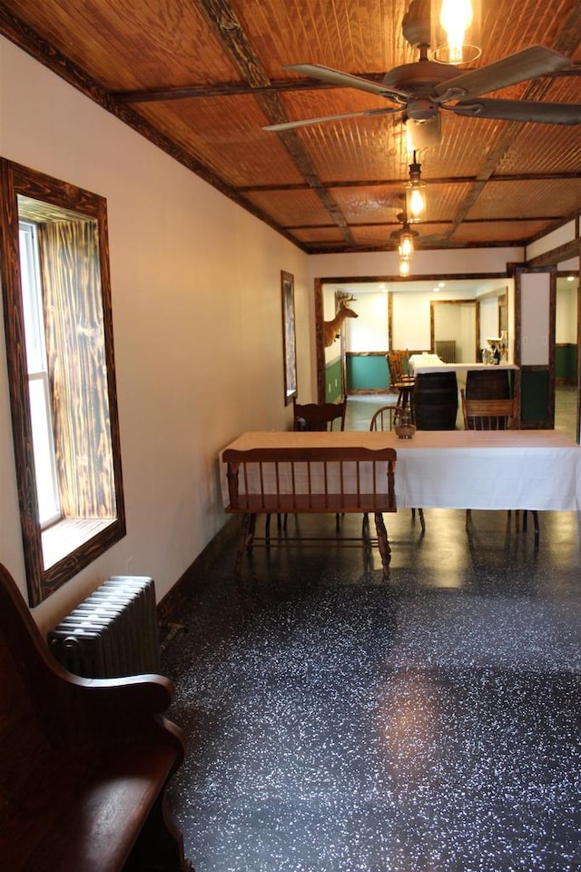 playroom featuring radiator heating unit, wood ceiling, and ceiling fan