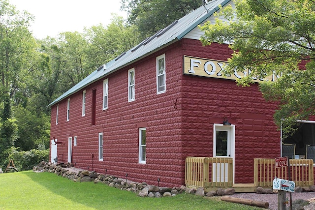 view of property exterior featuring a yard