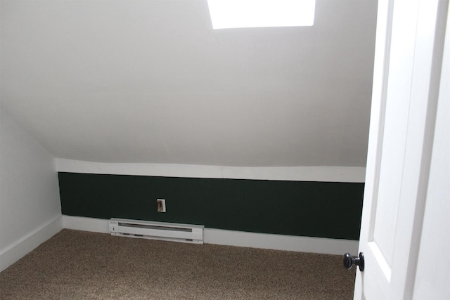 interior space with baseboard heating and carpet flooring