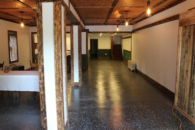 hallway with radiator heating unit and wooden ceiling