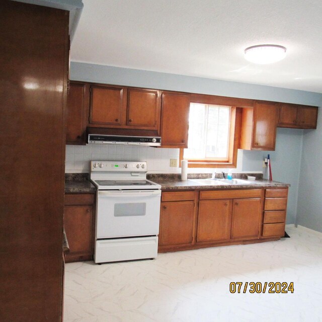 kitchen featuring extractor fan, sink, light tile patterned floors, decorative backsplash, and white electric range