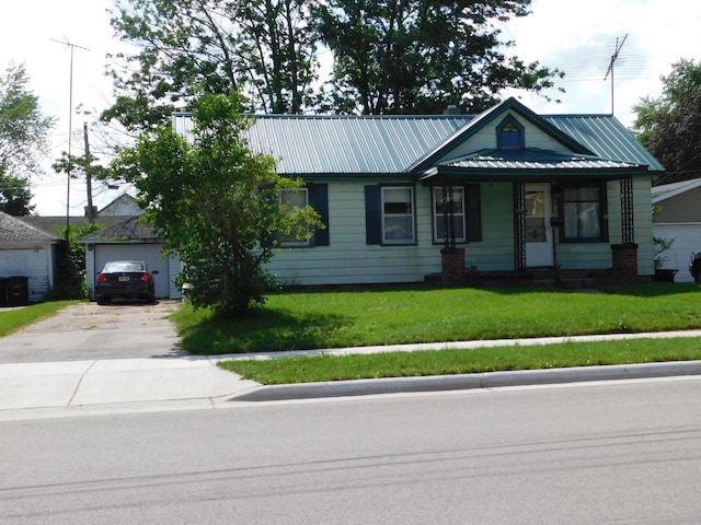 ranch-style house with a garage and a front lawn