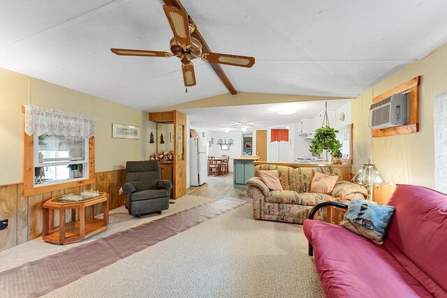 living room featuring ceiling fan, wooden walls, a wall mounted AC, and lofted ceiling with beams