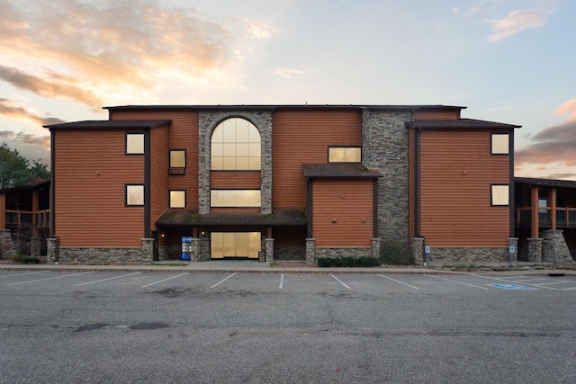 view of outdoor building at dusk