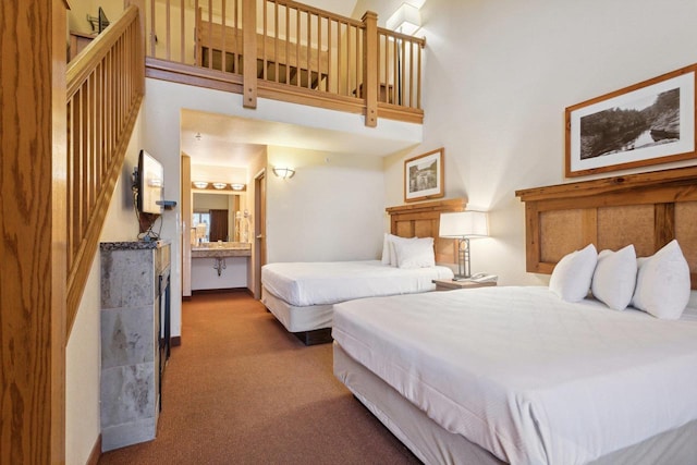 carpeted bedroom featuring a towering ceiling