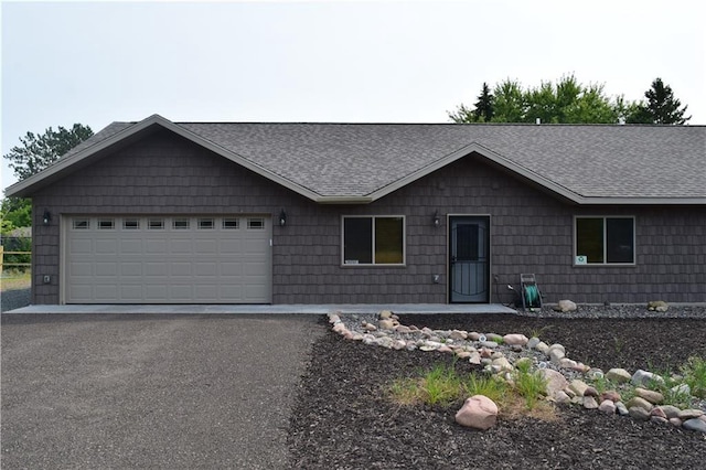 single story home featuring a garage