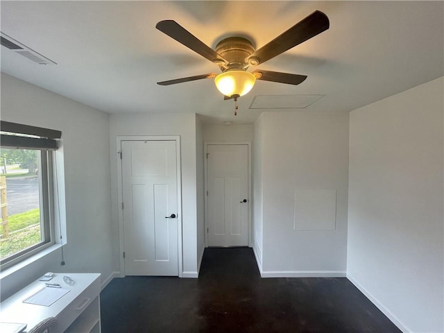 interior space with ceiling fan