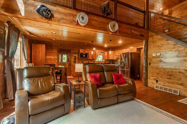 interior space featuring wooden walls, light hardwood / wood-style flooring, and wooden ceiling