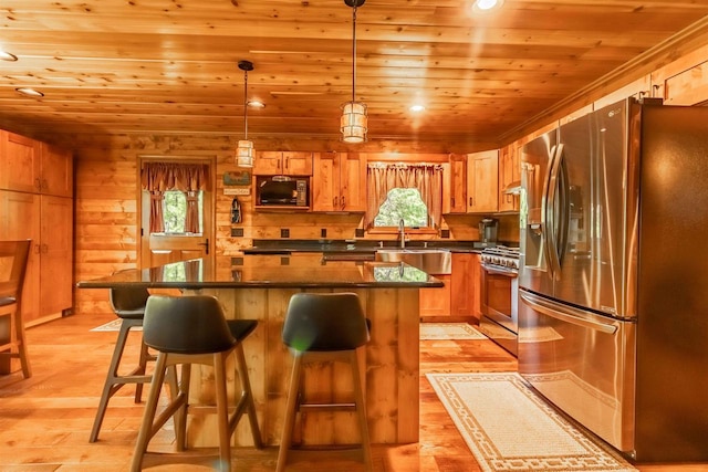 kitchen featuring pendant lighting, a center island, wood ceiling, stainless steel appliances, and light wood-type flooring