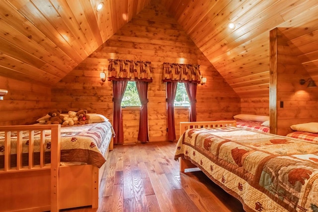 bedroom with wood ceiling, vaulted ceiling, and light wood-type flooring