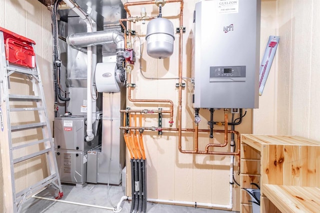 utility room featuring tankless water heater