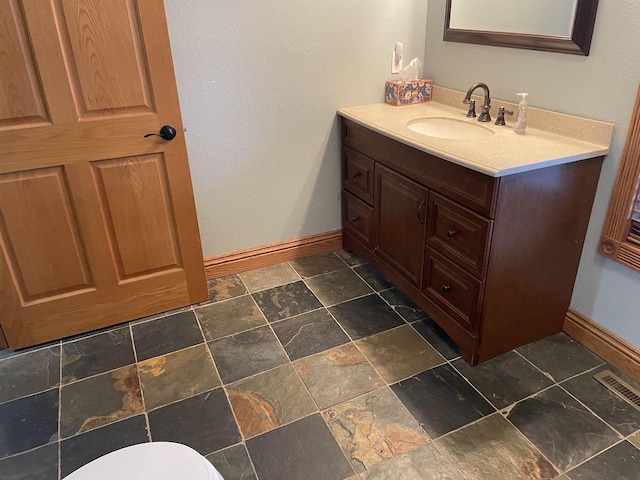 bathroom featuring tile patterned floors and vanity