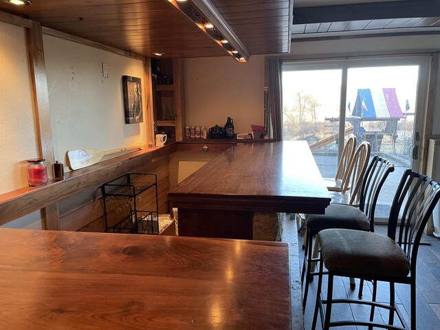 dining area featuring wooden ceiling