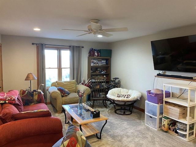 carpeted living room featuring ceiling fan