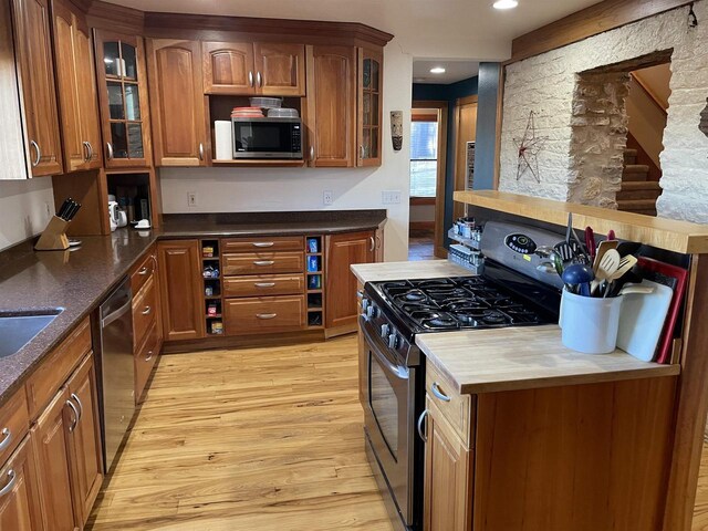 kitchen featuring light hardwood / wood-style floors and appliances with stainless steel finishes